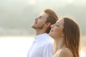 couple-of-man-and-woman-breathing-deep-fresh-air-picture-id516281699 (3)