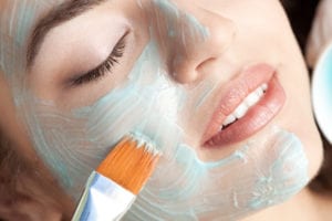 Healthy spa: young beautiful relaxing woman having moistening mask applied. PLEASE, CLICK FOR SIMILAR IMAGES AND LIGHTBOXES .