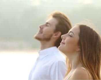 couple-of-man-and-woman-breathing-deep-fresh-air-picture-id516281699-3-350x275